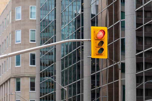 Traffic light against office buildings in downtown Ottawa, Canada. - Photo, Image