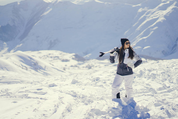 young and active brunette skiing in the snowy mountains - Foto, immagini