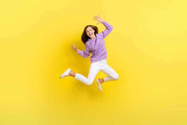 Full length photo of cheerful positive lady schoolkid learner stylish jumper rejoice good mark isolated on yellow color background. - 写真・画像