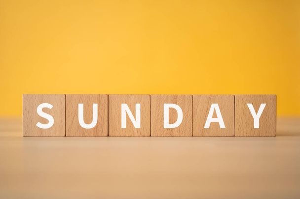 Wooden blocks with "SUNDAY" text of concept. - Фото, изображение
