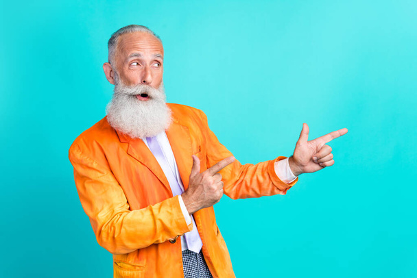 Photo of funky cool man showman dressed retro stylish costume two arm direct empty space cool proposition isolated on cyan color background. - Zdjęcie, obraz