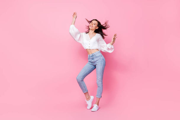 Full body photo of lovely young lady dancing feeling free comfort lightness dressed stylish white outfit isolated on pink color background. - Fotografie, Obrázek