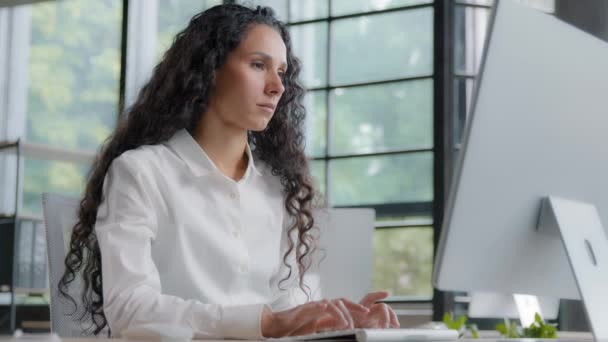 Focused serious tired businesswoman working in office on computer upset woman feeling frustrated due to problem and software error loss of important data unsaved information reads bad news by email - Footage, Video