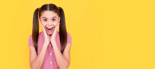 Surprised girl child touch beautiful face keeping mouth open with surprise, beauty. Child face, horizontal poster, teenager girl isolated portrait, banner with copy space - Fotografie, Obrázek