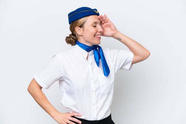 Airplane blonde stewardess woman isolated on white background has realized something and intending the solution - 写真・画像