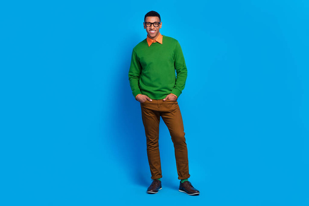 Full body length photo of satisfied professional programmer man put hands pockets rich business owner company isolated on blue color background. - Zdjęcie, obraz