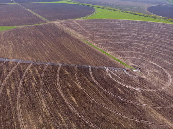 Spring. Countryside. Pivot irrigation works on the field. Drone. Aerial view - Foto, immagini