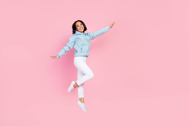 Full length photo of overjoyed cheerful pretty lady rejoice enjoy free time weekend vacation empty space isolated on pink color background. - Fotoğraf, Görsel