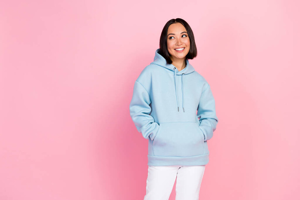 Photo portrait of gorgeous cute young woman look empty space sportswear dressed stylish blue clothes isolated on pink color background. - Fotoğraf, Görsel