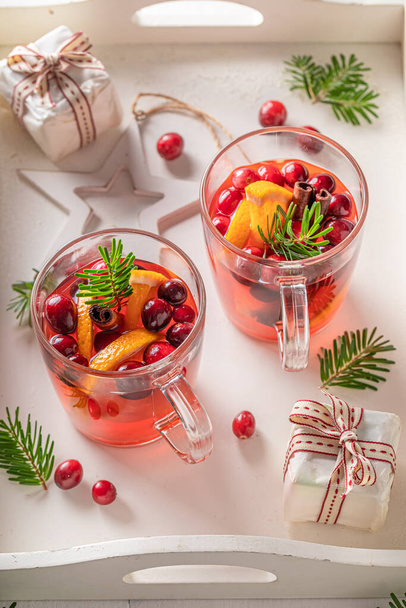 Tasty Christmas punch in a glass with spices and fruits. Traditional drink on winter holiday. - Fotografie, Obrázek
