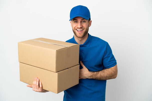 Delivery man over isolated white background smiling a lot - Photo, Image