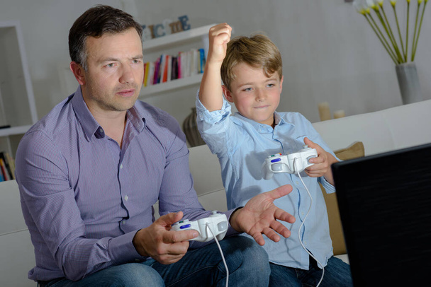 father and son video game playing - Foto, Bild