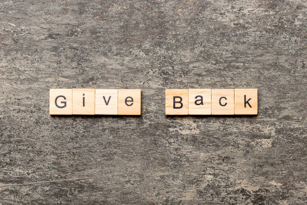 Give Back word written on wood block. Give Back text on table, concept. - Fotoğraf, Görsel