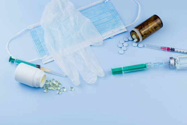 white medical protective glove, medical mask, syringe with needle, vaccination, vial and pills. illegal doping in sport concept ,flu vaccine, drug a addicted, wet medical. medical  item background - Photo, Image