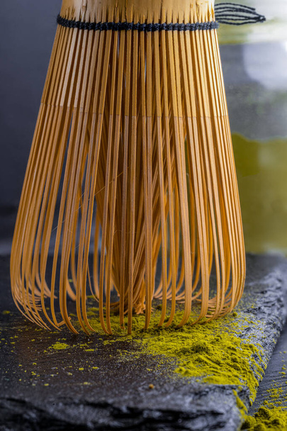 Bamboo whisk with matcha tea. High quality photo - Фото, зображення