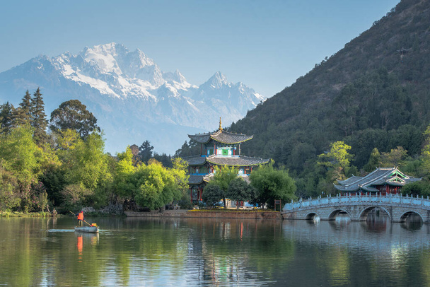 Travel China, Black Dragon Pool Landscape, a famous pond in the scenic Jade Spring Park located at the foot of Elephant Hill, a short walk north of the Old Town of Lijiang in Yunnan province. - Photo, Image