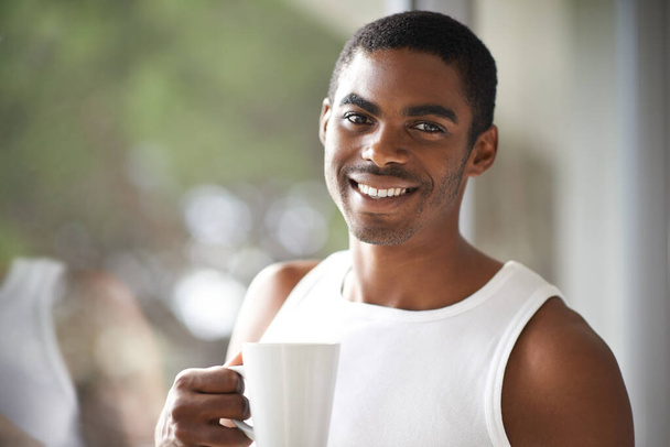 Relaxing before my busy day. A handsome male holding a hot beverage - Foto, immagini