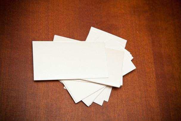 Blank business card on a wooden background - Photo, image