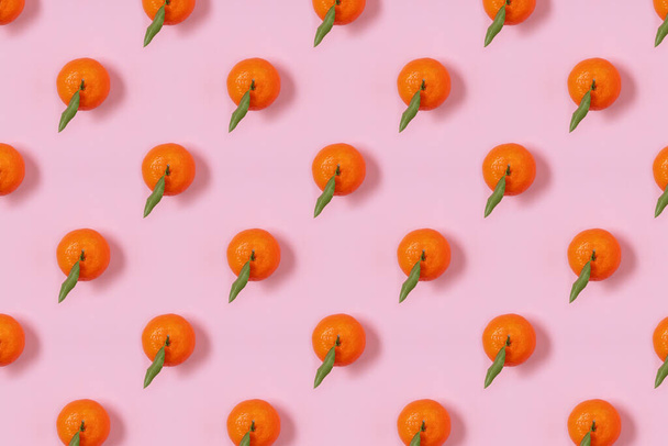 Mandarin oranges pattern on pink background. Creative pattern, fruit background. - Fotografie, Obrázek