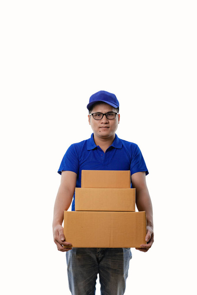 Delivery concept - portrait of asian delivery man in blue clothes holding boxes Isolated on studio backgroundYoung Asian courier holding mailbox isolated on white background - Photo, Image
