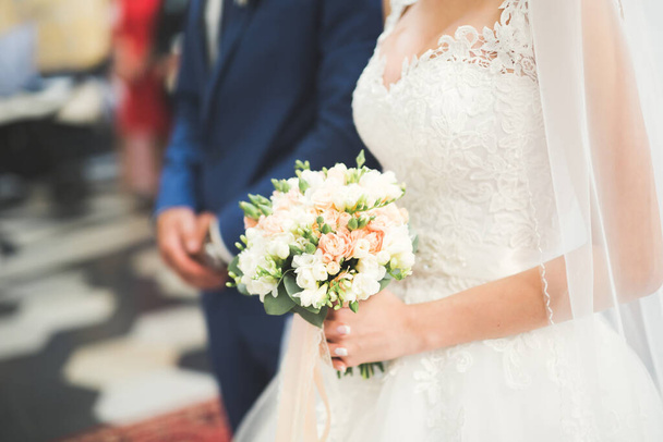 Bride holding big and beautiful wedding bouquet with flowers. - Foto, immagini