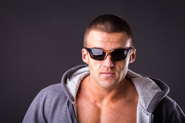 Man in a sports jacket and sunglasses - Photo, Image