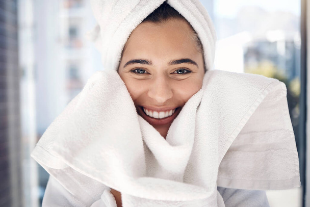 Face, towel and portrait of woman, shower or bathroom, aesthetic and body care, wellness or beauty. Happy, morning and smile young girl cleaning face, drying skincare and facial dermatology cosmetics. - Φωτογραφία, εικόνα