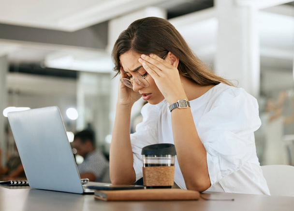 Freelance woman, burnout headache and head pain from work stress, overtime and mental health fatigue problem. Remote worker, tired and unwell while suffering from bad migraine, anxiety and exhaustion. - Photo, Image