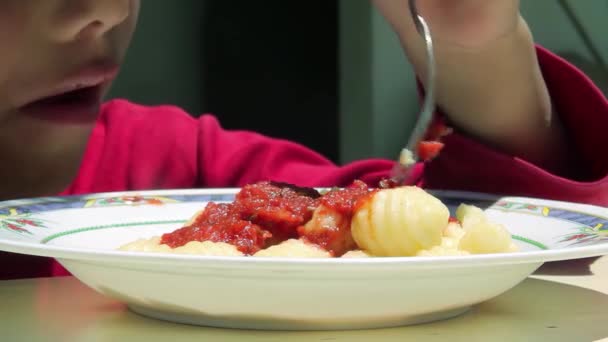 Young Student Eating Gnocchi Dish at Canteen inside a Public School in Argentina. Close Up. 4K Resolution. - Footage, Video