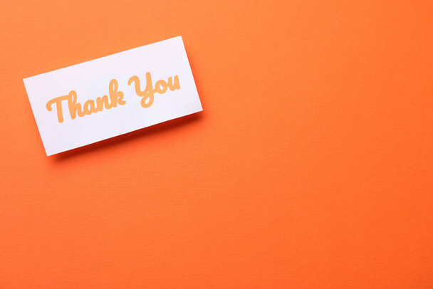 Note with phrase Thank You on orange background, top view. Space for text - Photo, Image