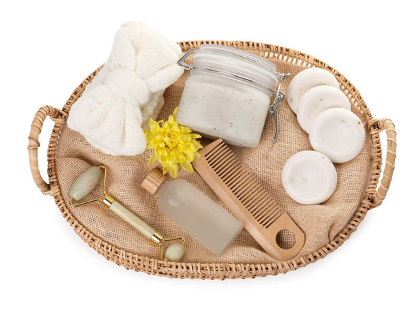 Spa gift set with different products in wicker basket on white background, top view - Foto, afbeelding