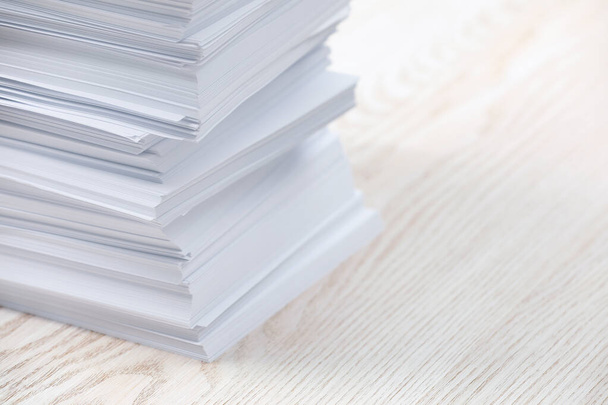 Stack of paper sheets on white wooden table, closeup. Space for text - Fotó, kép