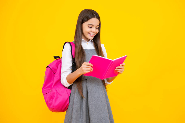 School teenager child girl with book and copybook. Teenager student, isolated background. Learning and knowledge. Go study. Education concept - Фото, изображение