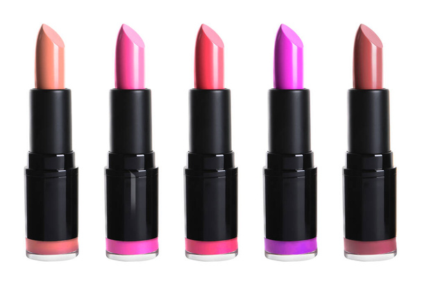 Set with different beautiful lipsticks on white background - Foto, imagen