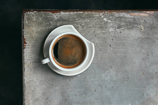 Cup of fresh and aroma black coffee on wooden table.  - Fotó, kép