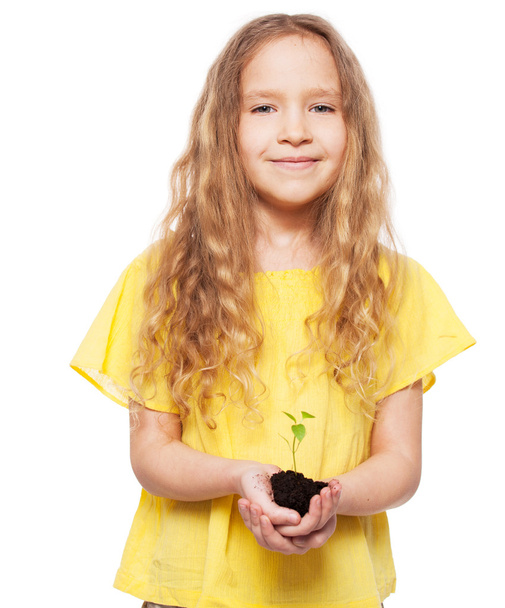 Child holding a sleedling - Valokuva, kuva