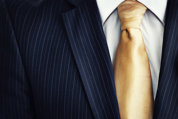 Illegal proceeds in his pocket. Closeup of a suit jacket and tie of a businessman - Foto, Imagem