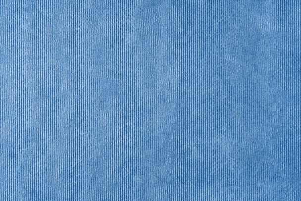 Текстура фона из голубой ткани велюра. Вельветовая текстурная ткань, вельветовый мебельный текстильный материал, дизайн интерьера, декор. Ткань хребта текстура крупным планом, фон, обои. - Фото, изображение