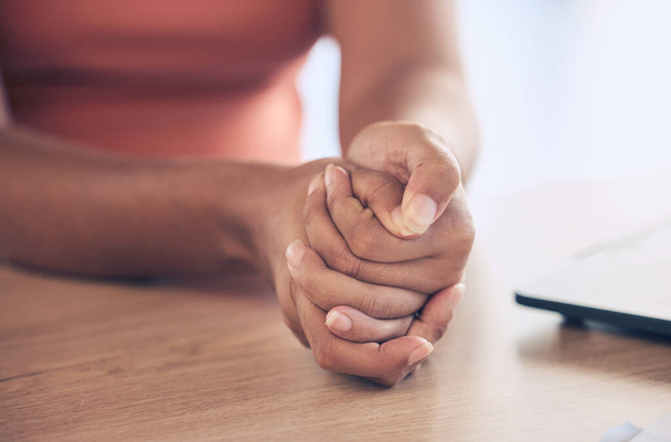 Anxiety, stress and hands with worry on table in workplace for thinking, contemplation and making decision. Mental health, depression and stressed black woman employee with hand together on desk. - 写真・画像