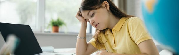 tired schoolgirl sitting with closed eyes near laptop with blank screen, banner - Фото, изображение