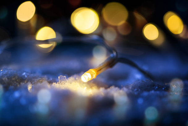 christmas string lights in snow - Photo, Image