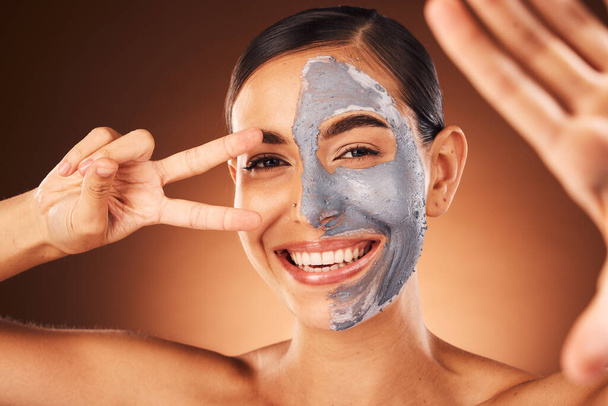 Beauty, portrait and woman taking selfie with face mask and peace sign hand gesture in studio for skincare. Smile, peeling and happy girl model taking pictures in facial dermatology cosmetics cream. - Zdjęcie, obraz