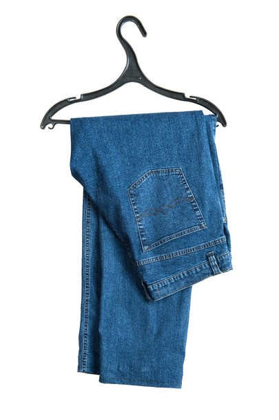 hanger met jeans op wit - Foto, afbeelding