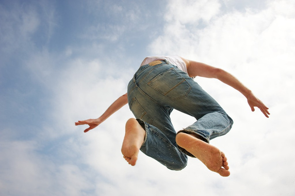 Man jumping against blue sky - Valokuva, kuva