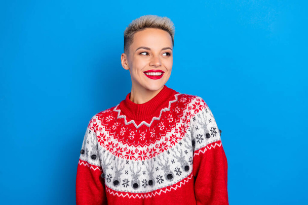 Photo of good mood optimistic satisfied girl with short hairstyle dressed red sweater look empty space isolated on blue color background. - Фото, зображення