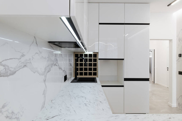 new bright Studio Kitchen with white furniture and lighting - Photo, Image