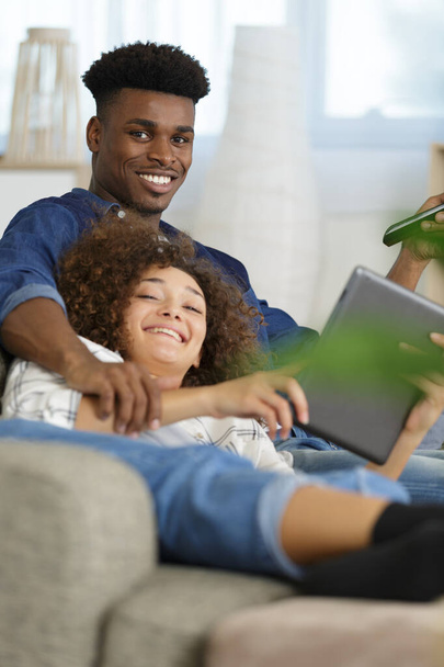 smiling happy couple with tablet pc - Photo, image