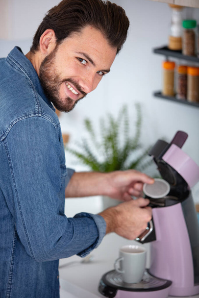 man pouring a mug of hot filtered coffee - Photo, image
