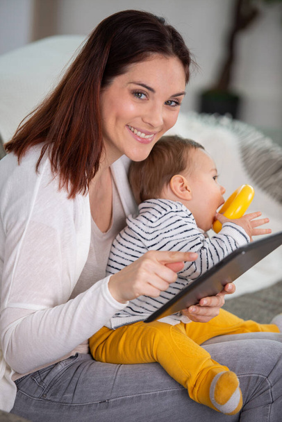 mother and baby play and read tablet computer - Photo, image