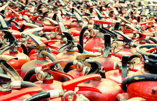 The fire extinguisher used. background with a lot of fire extinguishers - Photo, Image